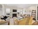 Bright living room featuring a fireplace, modern furniture and decor, and lots of natural light at 310 N Dotger N Ave # 4, Charlotte, NC 28204