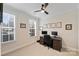 Bright office space featuring two windows, a ceiling fan, and a spacious desk at 310 N Dotger N Ave # 4, Charlotte, NC 28204