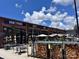 Lively exterior with Honeymonk, Smitty, and Koontz branding, plus inviting patio at 3163 Maury St, Charlotte, NC 28208