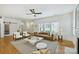 Bright living room with a comfortable sofa, modern decor, and hardwood floors illuminated by natural light at 3163 Maury St, Charlotte, NC 28208