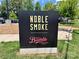 Eye-catching Noble Smoke and Beulah's Chicken Shack signage at 3163 Maury St, Charlotte, NC 28208