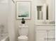 Bright bathroom with white cabinets, tile flooring, shower/tub combo and modern fixtures at 3882 Horsham St, Indian Land, SC 29707