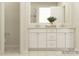 Bathroom featuring a double vanity with storage, tile flooring, and modern fixtures at 3882 Horsham St, Indian Land, SC 29707