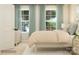 Comfortable bedroom featuring two windows, a plush bed, and neutral decor at 3882 Horsham St, Indian Land, SC 29707