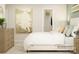 Cozy bedroom with neutral tones, stylish decor and large surfing wall art at 3882 Horsham St, Indian Land, SC 29707