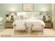 Stylishly decorated bedroom with matching nightstands, lamps, chairs, and a neutral color palette at 3882 Horsham St, Indian Land, SC 29707