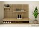 Sleek home gym featuring slat wall, modern storage bench, and fitness equipment for a balanced workout space at 3882 Horsham St, Indian Land, SC 29707