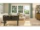 Bright living room featuring a foosball table, plush seating, and large windows for ample natural light at 3882 Horsham St, Indian Land, SC 29707