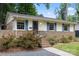Charming single-story home featuring brick accents, a well-maintained yard, and inviting curb appeal at 3900 Langley Rd, Charlotte, NC 28215