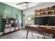This home office features a built-in desk, shelving, and a large window at 3900 Langley Rd, Charlotte, NC 28215