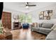 Cozy living room with hardwood floors, comfortable seating, and natural light from the windows at 3900 Langley Rd, Charlotte, NC 28215