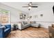 Comfortable living room with hardwood floors, a sectional sofa, and plenty of natural light at 3900 Langley Rd, Charlotte, NC 28215