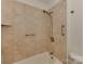 Bathroom featuring a tile shower and tub with accessible grab bars and showerhead at 4025 Woodfox Dr, Charlotte, NC 28277