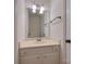 Neutral powder room with vanity sink, lighting, and a large mirror at 4025 Woodfox Dr, Charlotte, NC 28277