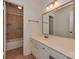 Bathroom with vanity and sink and a tile shower and tub combination at 4025 Woodfox Dr, Charlotte, NC 28277