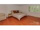 Bedroom with hardwood floors, natural light, and ample space at 4025 Woodfox Dr, Charlotte, NC 28277