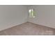 Cozy bedroom with neutral carpet, natural light, and ample space at 4025 Woodfox Dr, Charlotte, NC 28277