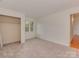 Spacious bedroom with carpet, closet, and window, offering a serene retreat at 4025 Woodfox Dr, Charlotte, NC 28277