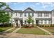 Attractive townhomes boast stone accents, vinyl siding, manicured lawns and inviting curb appeal at 4117 Galloway Park Dr, Charlotte, NC 28262