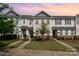 Attractive townhomes boast stone accents, vinyl siding, manicured lawns and inviting curb appeal at 4117 Galloway Park Dr, Charlotte, NC 28262