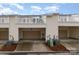 Townhome featuring private balconies, attached garages, and well-maintained landscaping at 4117 Galloway Park Dr, Charlotte, NC 28262