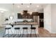 Modern kitchen features stainless steel appliances, granite countertops, and a central island with bar stool seating at 4117 Galloway Park Dr, Charlotte, NC 28262