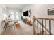 Upstairs loft with neutral carpet, ample natural light, cozy seating, and convenient access to the balcony at 4117 Galloway Park Dr, Charlotte, NC 28262