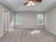 Bedroom features vaulted ceiling, ceiling fan, and two windows providing ample natural light at 4208 Everest Dr, Gastonia, NC 28054