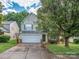 Charming two-story home with a well-manicured lawn and a two-car garage at 4208 Everest Dr, Gastonia, NC 28054