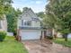 Traditional two-story home featuring green shutters and a two-car garage at 4208 Everest Dr, Gastonia, NC 28054