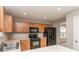 Well-equipped kitchen featuring wood cabinets and black appliances at 4208 Everest Dr, Gastonia, NC 28054
