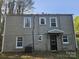 Rear exterior of the house, revealing multiple windows and access door at 435 W Sharpe St, Statesville, NC 28677