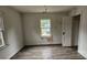 A bedroom has vinyl wood flooring and is in need of repairs at 435 W Sharpe St, Statesville, NC 28677