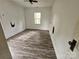 Bedroom with new laminate flooring, a ceiling fan, and a bright window at 435 W Sharpe St, Statesville, NC 28677