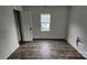 A bedroom has vinyl wood flooring and is in need of repairs at 435 W Sharpe St, Statesville, NC 28677