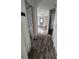 Hallway with modern flooring leading to an interior room with neutral walls at 435 W Sharpe St, Statesville, NC 28677