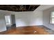 Living room with original hardwood flooring and a window view at 435 W Sharpe St, Statesville, NC 28677