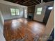 Living room featuring an unused fireplace and exposed ceiling at 435 W Sharpe St, Statesville, NC 28677