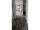 A room featuring modern laminate flooring, with an entrance to another space at 435 W Sharpe St, Statesville, NC 28677