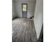 A room has vinyl wood flooring, white walls, and is in need of repairs at 435 W Sharpe St, Statesville, NC 28677