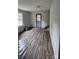 An open room with modern laminate flooring, providing access to the exterior at 435 W Sharpe St, Statesville, NC 28677