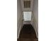 A staircase leading down to a room with vinyl wood flooring at 435 W Sharpe St, Statesville, NC 28677