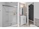 Modern bathroom with glass shower, vanity with white cabinets, and stylish tile accents at 4658 Cedar Rock Dr, Charlotte, NC 28273