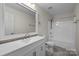 Bright bathroom featuring a stylish vanity with a large mirror and a combined tub and shower at 4658 Cedar Rock Dr, Charlotte, NC 28273