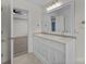 Bathroom vanity with dual sinks, decorative lighting, and a neutral color palette at 4658 Cedar Rock Dr, Charlotte, NC 28273