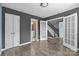 Empty bedroom featuring dual paint colors, hardwood floors, and several entryways at 4658 Cedar Rock Dr, Charlotte, NC 28273
