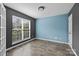 Bright, empty bedroom featuring dual paint colors, hardwood floors, and large window at 4658 Cedar Rock Dr, Charlotte, NC 28273