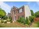 Two story red brick house with black shutters and well-maintained landscaping at 4658 Cedar Rock Dr, Charlotte, NC 28273