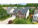 Two story red brick home with a well-maintained lawn and an attached garage in a suburban neighborhood at 4658 Cedar Rock Dr, Charlotte, NC 28273