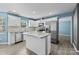 An open kitchen with marble countertops, white cabinets, and stainless steel appliances at 4658 Cedar Rock Dr, Charlotte, NC 28273